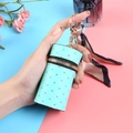 Mini borsa a secchiello verde menta trapuntata con strass e nastro portachiavi - verde chiaro