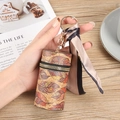 Cylindrical lipstick holder bag with brown feather pattern and silk scarf accessory - Feather Pattern (No.1)