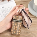 Cylindrical mandala print lipstick pouch with gold keychain and champagne satin ribbon - Retro Mandala (No.5)