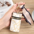 Estuche cilíndrico para llaves con estampado floral, cremallera dorada y pañuelo seda - Blanco
