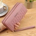 Pink women's long wallet with double zipper, floral quilting, and wrist strap - Deep Pink
