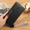 Black long women's wallet with quilted arc texture and ethnic geometric wrist strap - Black
