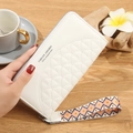 Quilted white long wallet for women with colorful ethnic wristlet and zip closure - White