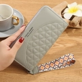 Grey long leather wallet for women with quilted pattern and colorful geometric wrist strap - Light Green