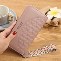 Dusty pink long quilted wallet for women featuring geometric wrist strap and zipper - Deep Pink