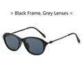 Gafas de sol retro cat-eye con montura negra brillante y lentes gris oscuro con filtro UV - Montura Negra Lentes Gris Negro