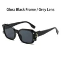 Gafas de sol negras brillantes con lentes gris oscuro y remaches dorados - Montura Negro Brillante Lente Gris