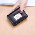 Black tri-fold minimalist wallet for women with pearl pin detail and leather texture - Black