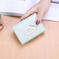 Mint green tri-fold faux leather wallet with golden ball clasp and pearl pin detail - Light Green