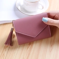 Elegant dusty pink tri-fold wallet for women with lychee texture and tassel charm - Deep Pink