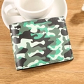Men's bifold wallet with green camouflage print on wood table with coffee cup - Green Camo