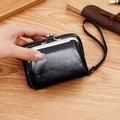 Vintage black oil-wax leather wallet with metal clasp and wrist strap detail - Black