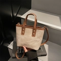 Retro canvas and leather handbag with brown trim and adjustable crossbody strap - Cream-Brown