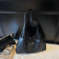 Classic black leather tote bag with vertical stitching for chic commuting style - Black