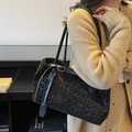 Dark leopard print tote bag with plush texture and thin black shoulder straps - Black
