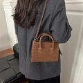 Brown leopard print crossbody bag in faux suede with gold hardware and dual handles - Brown