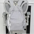 Klassischer schwarz-weißer Karo-Rucksack mit weißer Quaste und Logo-Detail - Grau Ohne Anhänger