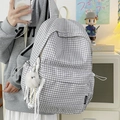 Classic black and white checkered canvas backpack with fuzzy pompom and white handle - Grey With Long Leg Plush Charm