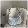 Detail of silver pleated shoulder bag with bow drawstring and metallic texture finish - Silver