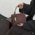 Deep brown quilted crossbody bag with frosted leather finish and gold hardware details - Brown