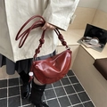 Minimalist deep red patent leather dumpling bag with stylish knotted shoulder strap - Red