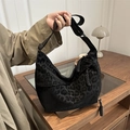 Large black leopard print nylon hobo bag with adjustable strap and braided zipper details - Black