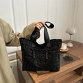 Large black leopard print tote bag with woven tassels and adjustable shoulder strap - Brown