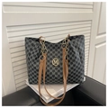 Detail of monogram tote bag with brown leather strap and gold chain accent - Black