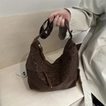 Brown leopard print crescent bag with woven zipper details and adjustable shoulder strap - Brown