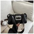 Close-up of black glossy leather bag with metallic silver buckle and eyelet details - Black