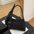 Minimalist black tote bag in matte suede texture with a stylish side strap charm - Black
