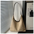 Detail of suede tote bag with brown leather strap and aesthetic shadow patterns - Khaki