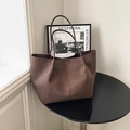 Large dark brown faux suede tote bag with slim shoulder straps on a sleek table - Coffee