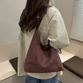 Minimalist burgundy suede tote bag featuring a spacious crescent design and matte texture - Brown