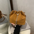 Retro brown matte bucket bag featuring drawstring closure with gold chain and pearl accents - Brown