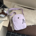 Light purple nylon crossbody bag with adjustable strap and metal M logo on knit surface - Purple