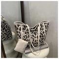 Detailed shot of large leopard print tote bag set with matching beige inner pouch - Black