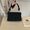 Chic black leopard print handbag with knotted handle and golden buckle detail - Black