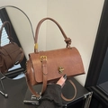 Vintage brown leather handbag with gold twist lock and adjustable shoulder strap - Brown
