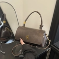 Vintage dark brown wax leather handbag with twisted handle and golden clasp hardware - Brown