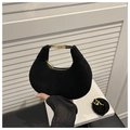 Detail of black suede dumpling bag featuring iconic gold buckle and sleek metal hardware - Black