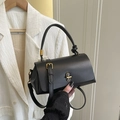 Minimalist black crossbody bag with knotted handle and vintage metal clasp - Black