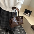 Dark brown glossy patent leather tote bag with silver buckle and adjustable shoulder strap - Brown