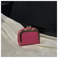 Close-up of rose red lychee leather coin purse with vintage gold metal clasp on silk - Rose Red