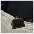 Detail of black lychee grain leather coin purse with golden kiss-lock closure - Black