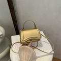 Mini borsa chic in oro metallizzato con trama a onde, manico e tracolla rimovibile - Oro