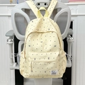 Light yellow polka dot backpack with black bow pattern and front pocket detail - Yellow Without Pendant