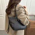 French style black bucket bag with white contrast stitching and lychee grain leather - Black