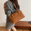 Camel faux leather large tote bag worn on shoulder with minimalist stitched detail - Brown
