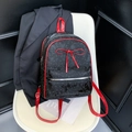 Polka dot black backpack with red bow and adjustable straps on a white chair - Black Polka Dot Style (No Pendant)